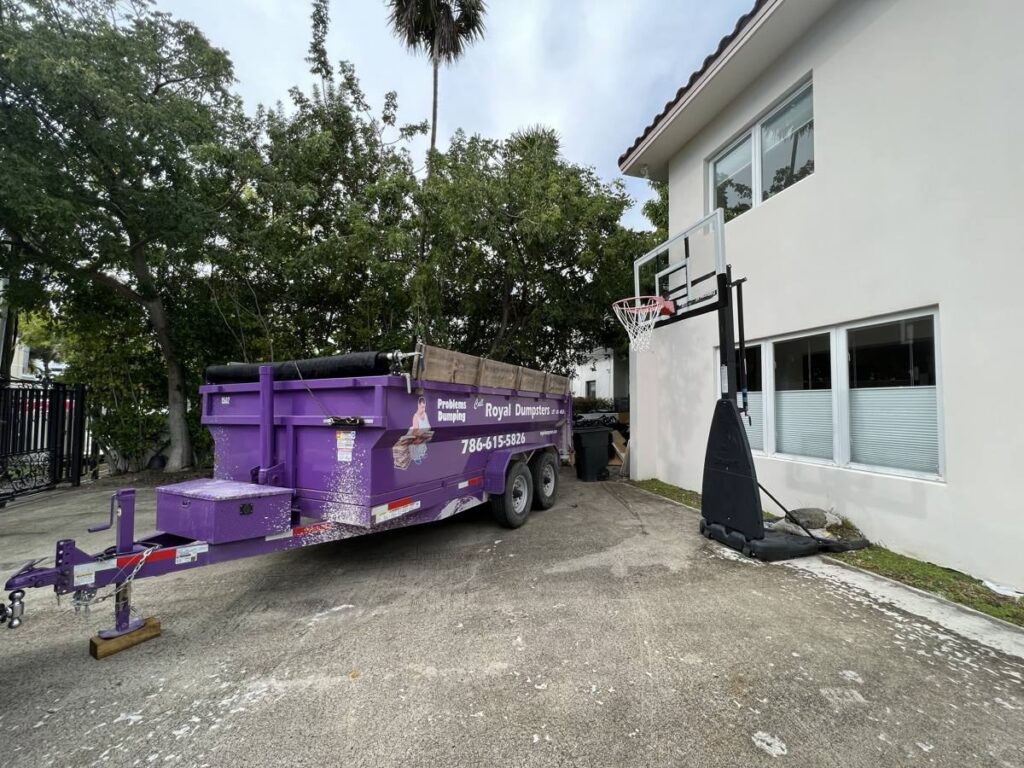 Dumpster placed in a tight residential driveway in Miami Beach, FL