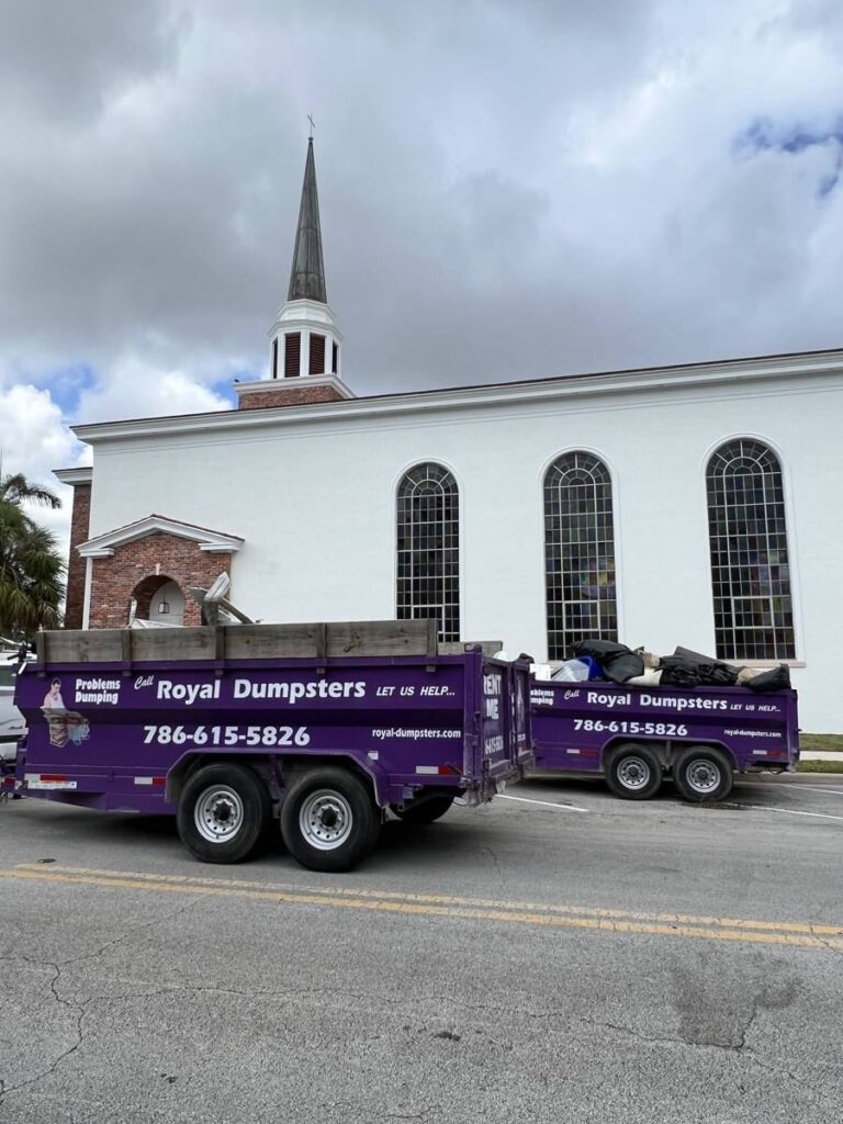 Royal Dumpsters truck swapping a dumpster container in Miami Shores, FL
